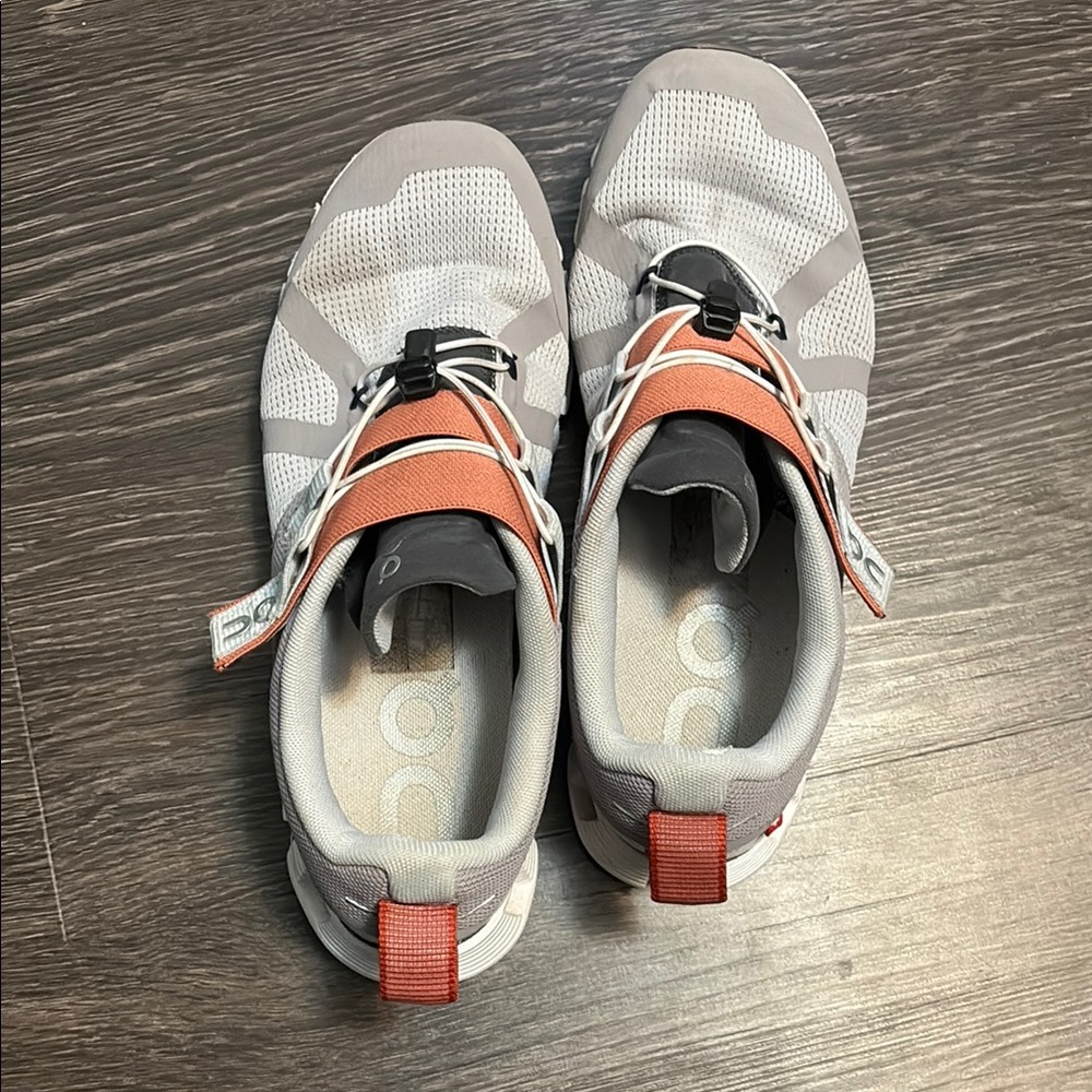 On Running Gray and Orange Athletic Shoes